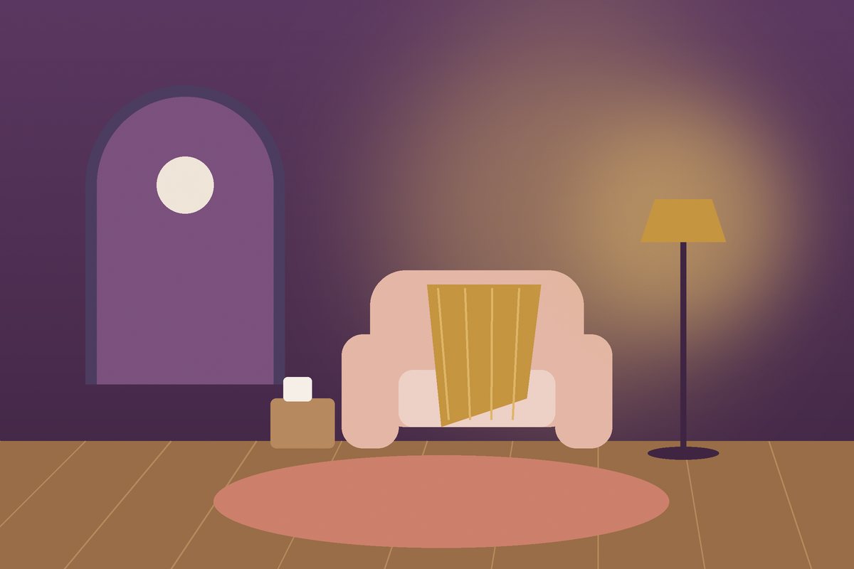 Warm armchair with a blanket, a floor lamp and a round rug